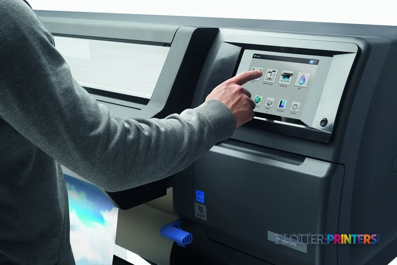Person operating the touchscreen control panel on an HP Latex 375 Printer Europe in a lifestyle setting