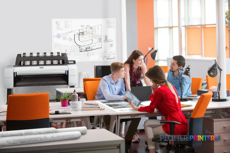 HP DesignJet T2600 36-in printer in a modern office with team reviewing large-format architectural plans