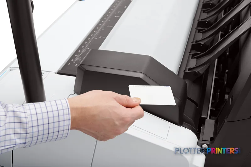HP DesignJet T2600 36-in PostScript Multifunction Printer lifestyle image showing a person removing printed paper from the o…