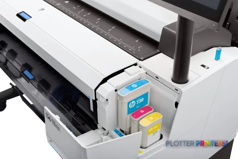 HP DesignJet T2600 36-in printer detail view showing ink cartridge compartment with cyan, magenta, and yellow cartridges ins…