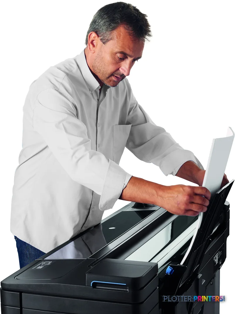 Man in white shirt using HP DesignJet T730 36-in Printer, holding printed output from the grey printer