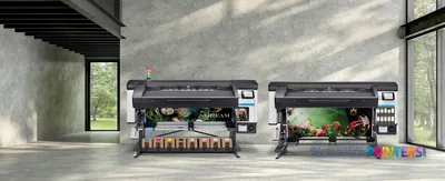 HP Latex 700 W Printer lifestyle image showing two large-format printers displaying vibrant floral prints in a modern studio…