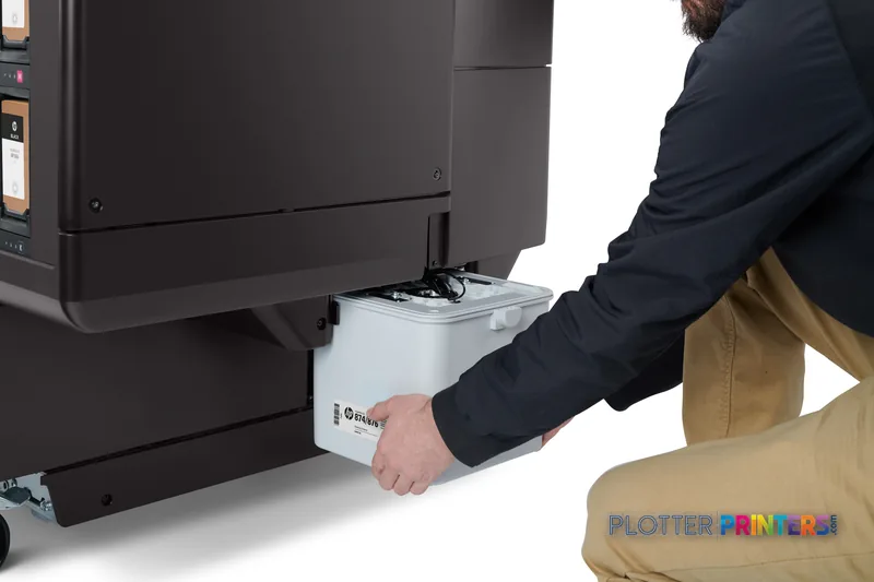 HP PageWide XL 4200 lifestyle image showing a person removing the white top stacker from the grey printer