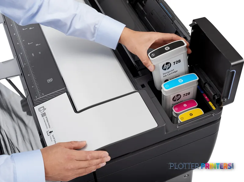 HP DesignJet T830 36-in Multifunction Printer lifestyle image showing user accessing ink cartridges and printed documents