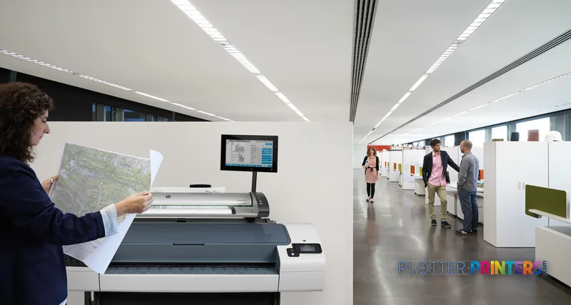 HP Designjet T790 44" printer lifestyle image showing woman holding large printed map in modern office