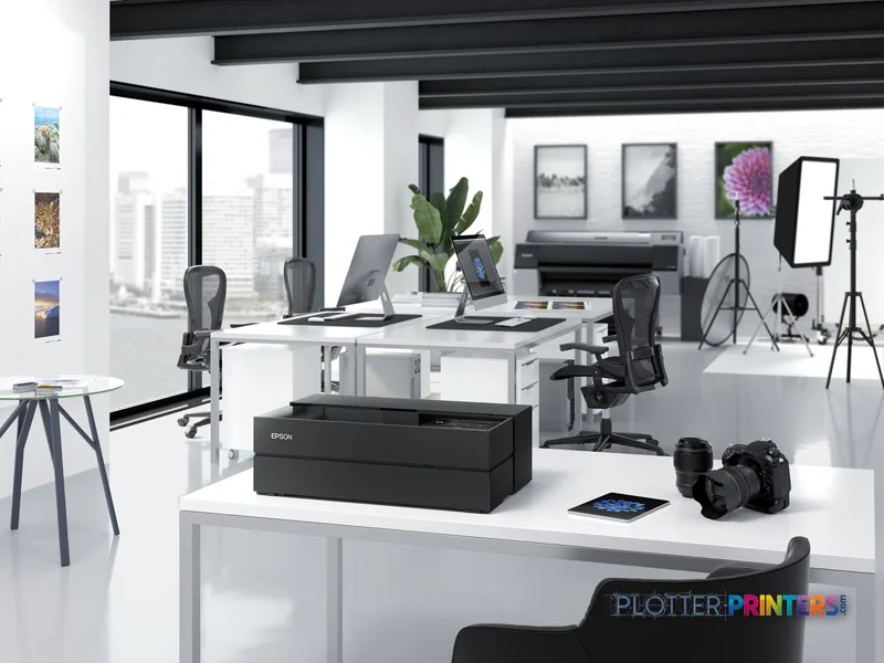 Epson SureColor SC-P700 large format printer product image showing black inkjet printer on white desk in creative studio