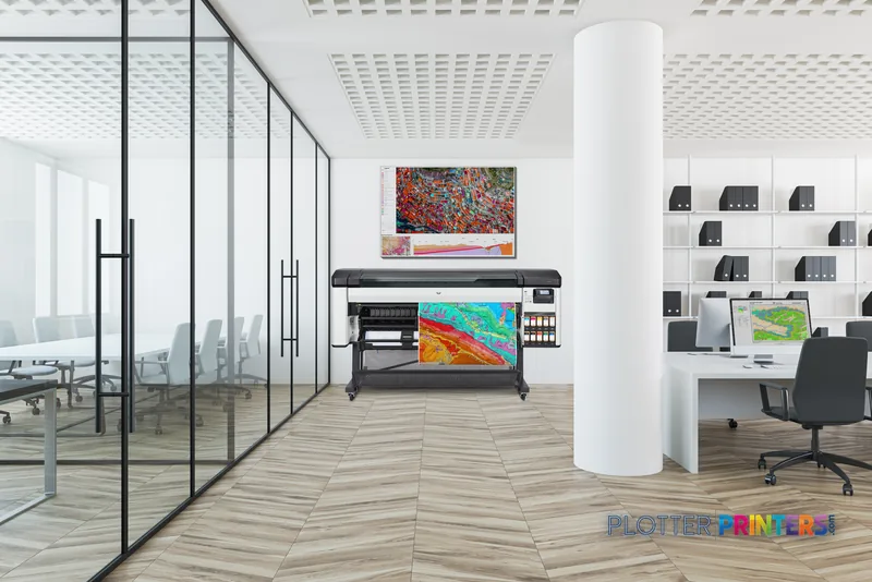 HP DesignJet Z9+ Pro 64-in printer lifestyle image showing the white and black printer in a modern office with colorful prin…