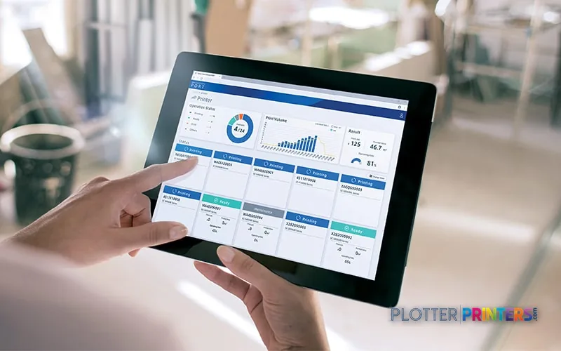 Person holding tablet displaying dashboard software interface, not the Epson SureColor SC-F10000H printer