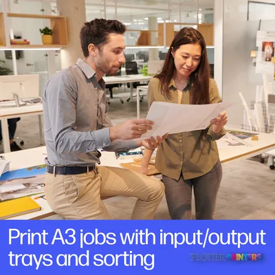Two professionals reviewing a large printed document in an office, with HP DesignJet T950 printer visible in background